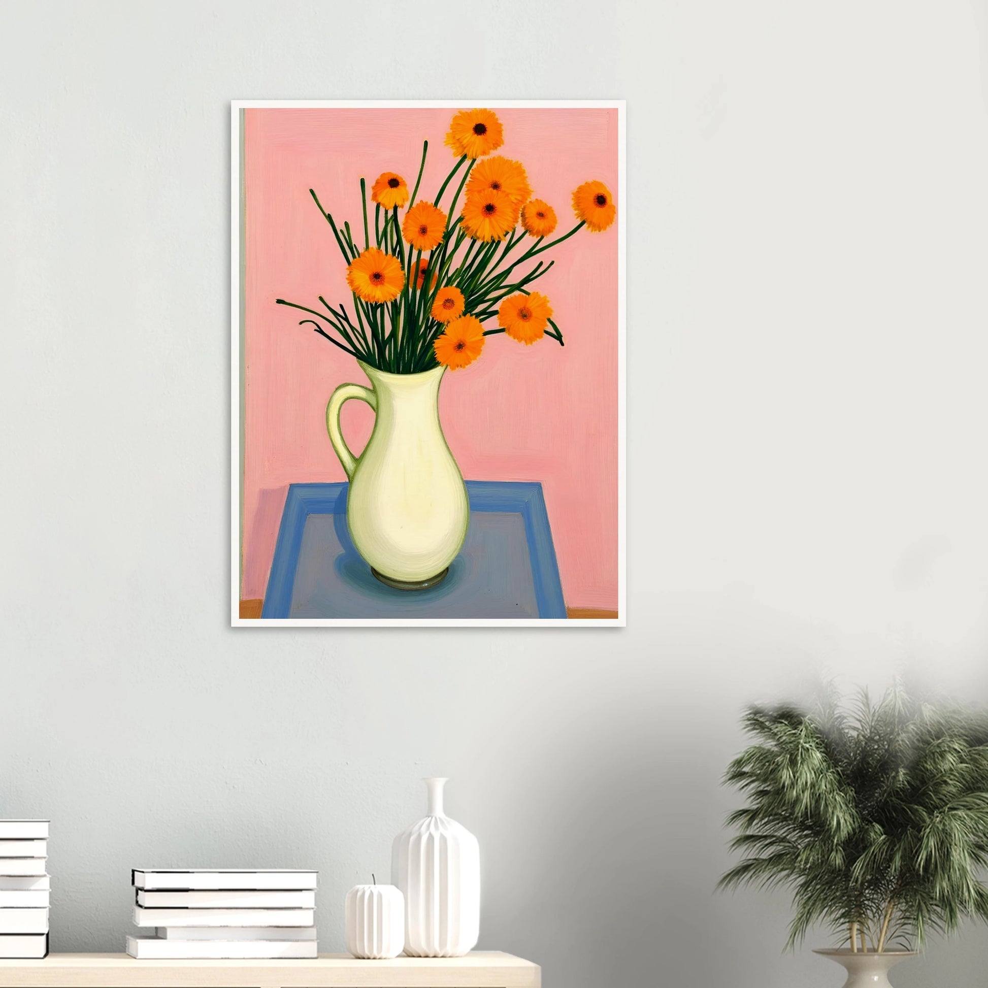 A vase of orange daisies with green stems against a soft pink background, radiating warmth and joy on a pastel tabletop.