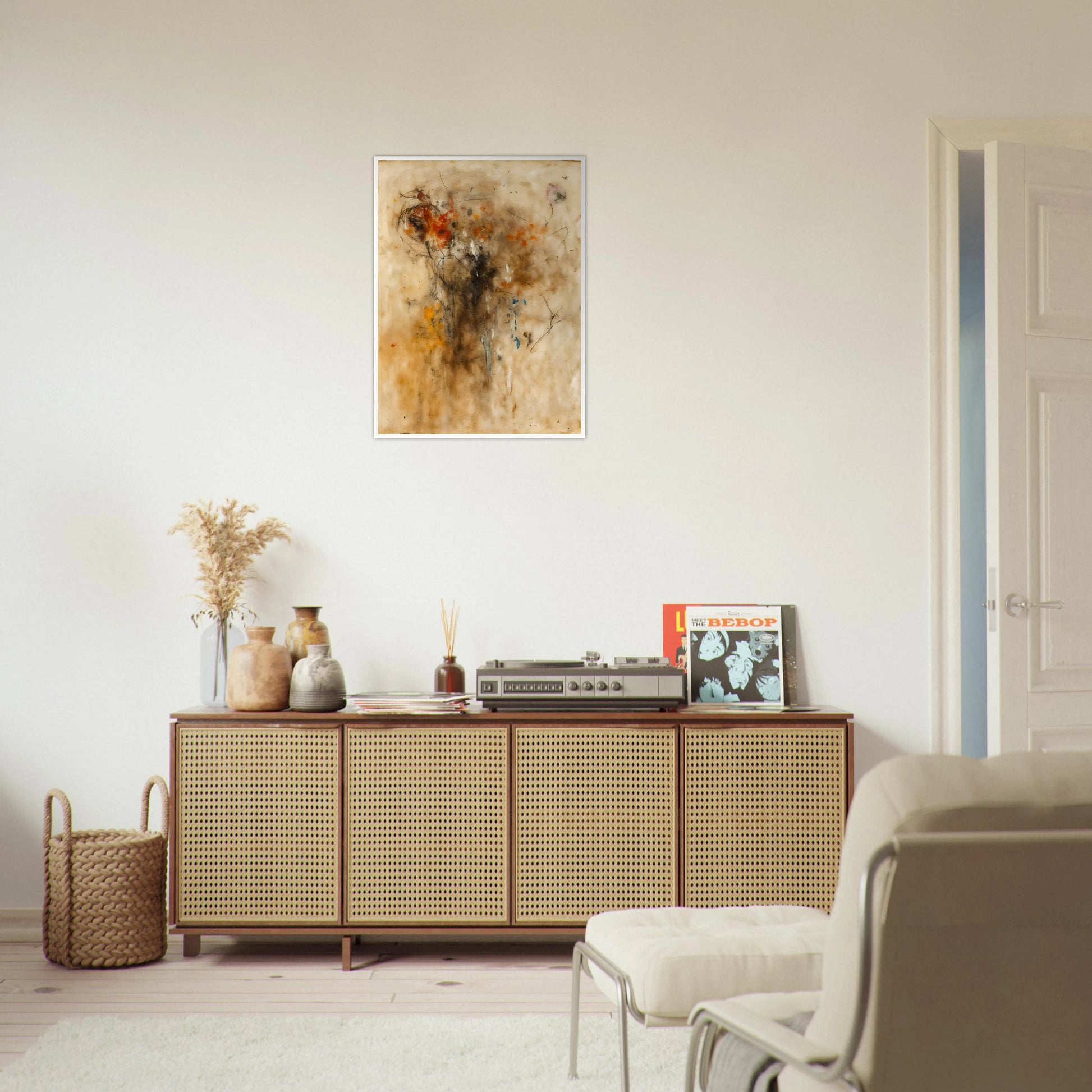 An expressive abstract painting featuring gestural lines, smoky textures, and warm earth-toned washes. Hints of a human-like form emerge from layered marks of black, rust, cream, and subtle blue against a parchment-colored background.