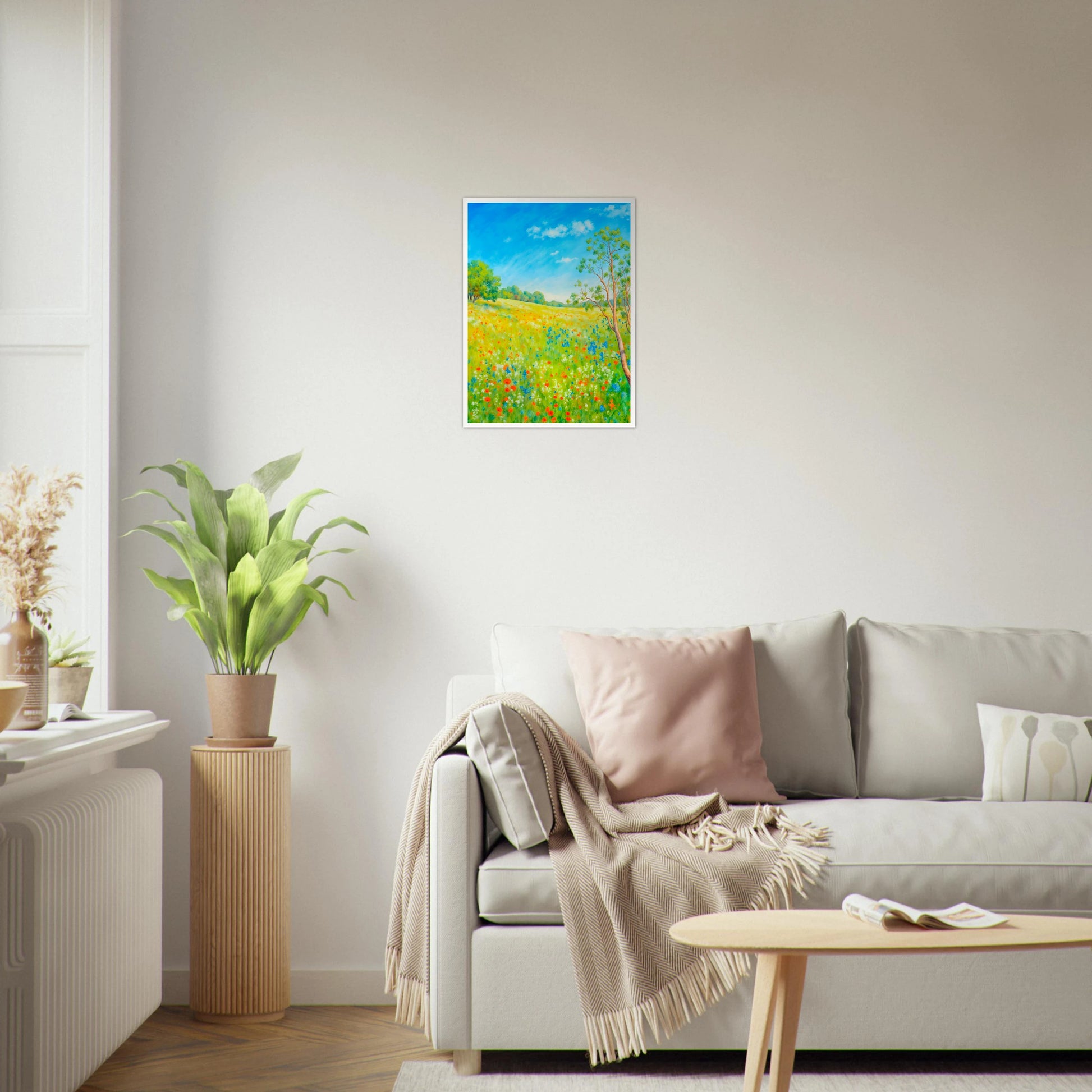 Bright wildflower meadow under clear blue sky with delicate trees, colorful blossoms, and sunlit greenery stretching across a serene spring landscape.