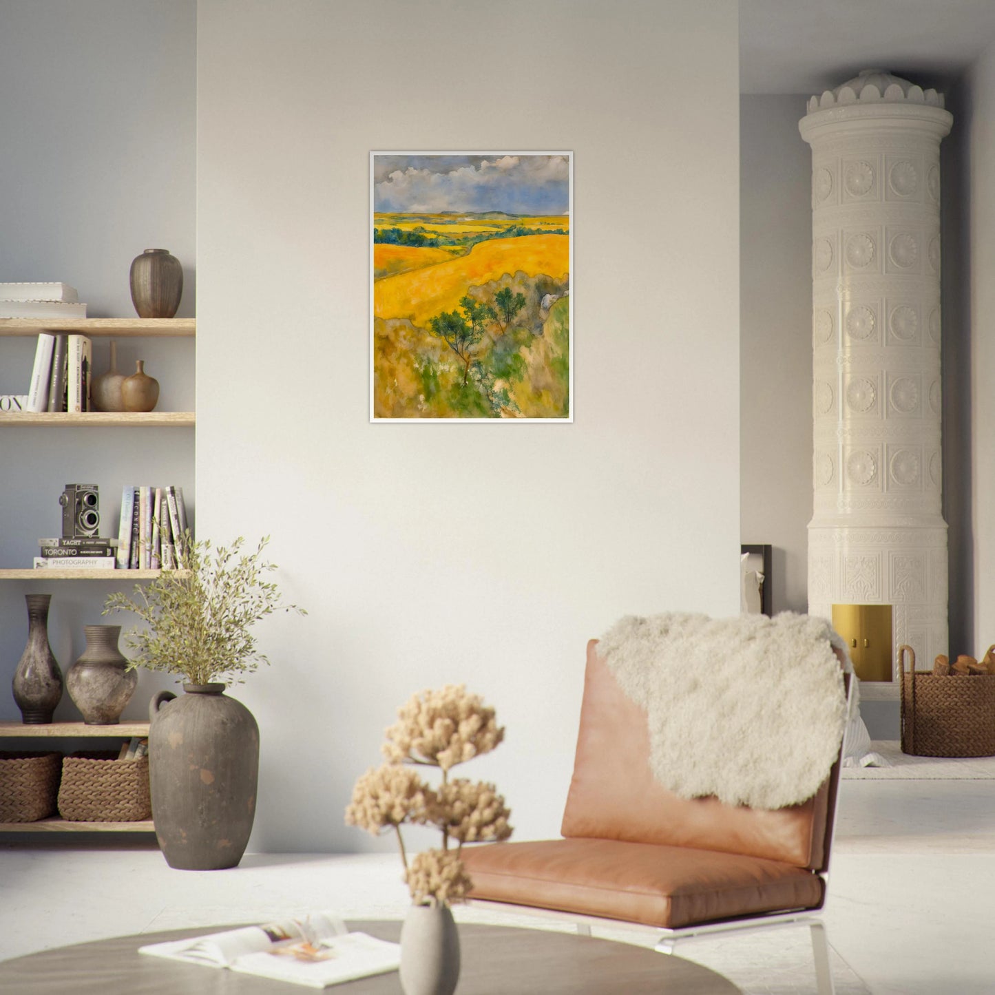 Golden fields stretch across rolling hills under a blue and cloudy sky, with trees dotting the lush summer landscape.