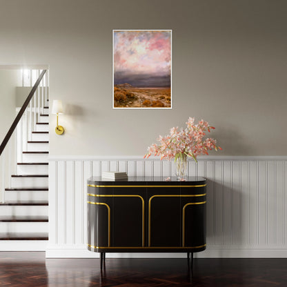 A dreamy desert landscape beneath soft pink and lavender clouds, with golden brush, distant hills, and a tranquil open horizon.