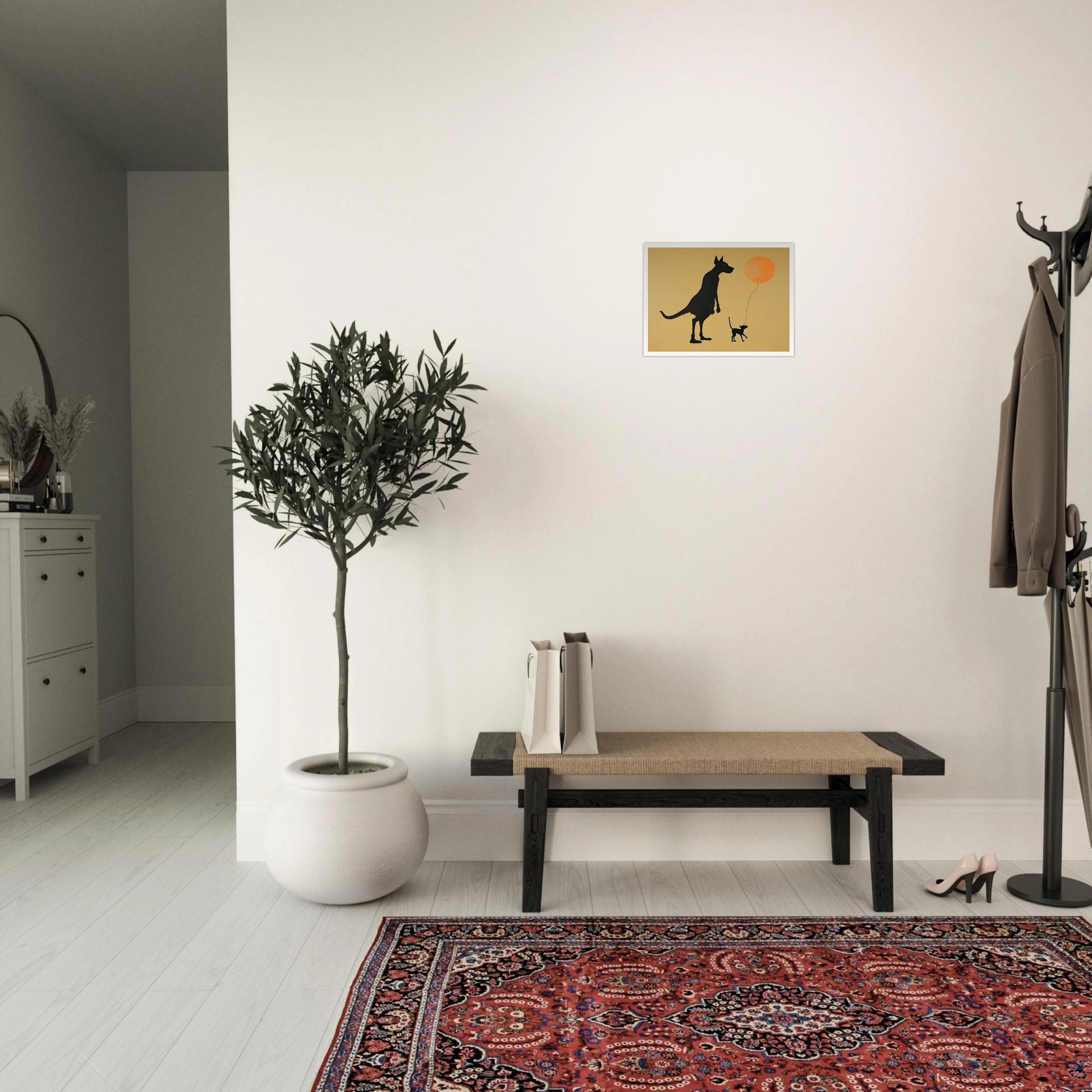 Two silhouetted dogs stand under a soft tan sky, one holding an orange balloon, capturing a playful moment of friendship.