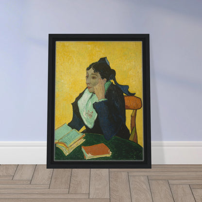 Woman in black and green sits at a table with open books against a vivid yellow background.