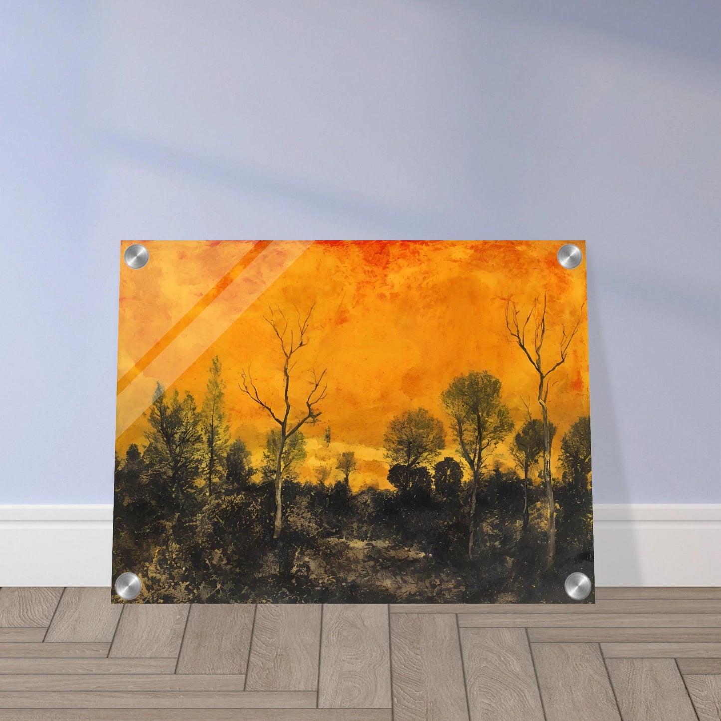 A forest silhouetted against a blazing orange sky, with leafless and leafy trees under a textured sunset.