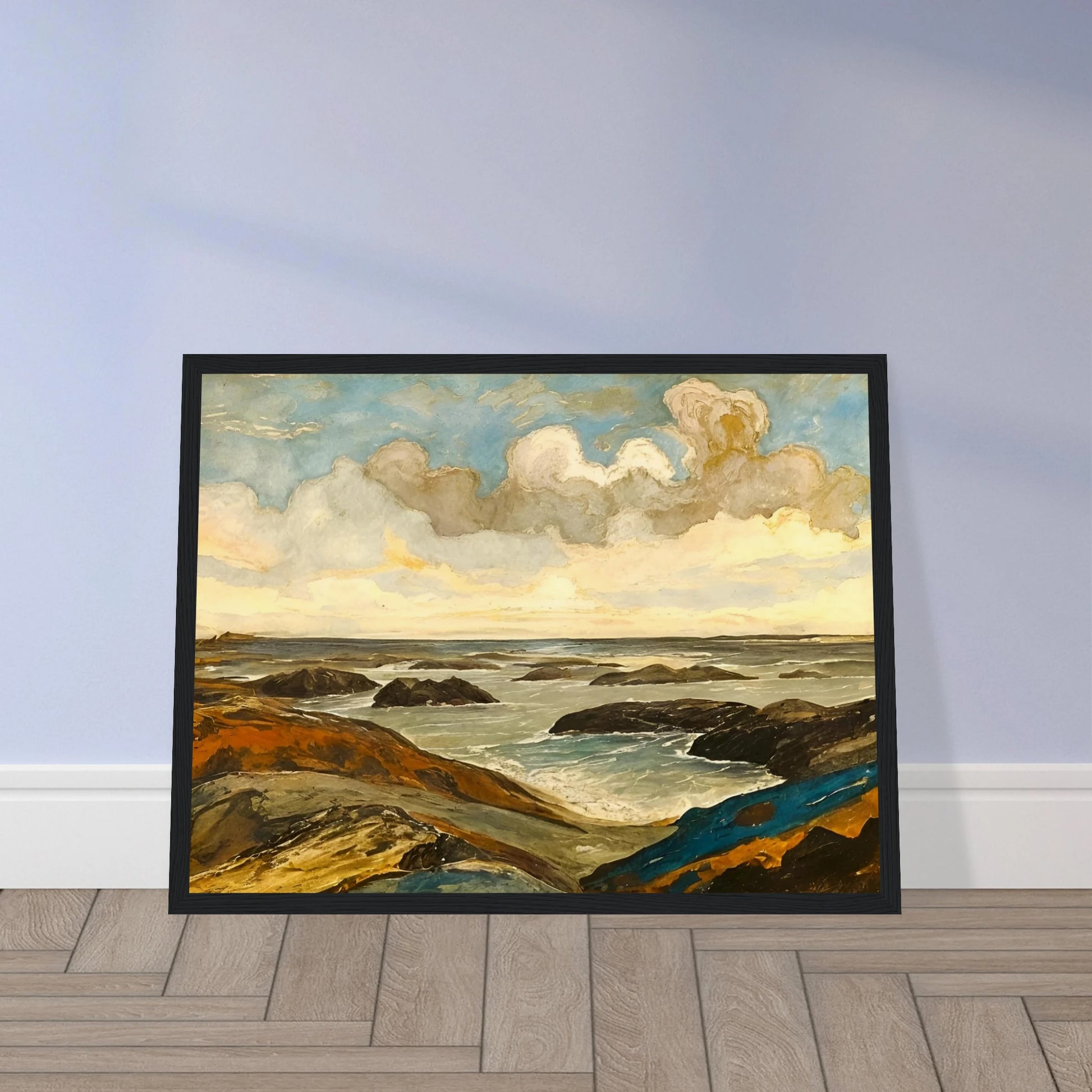 Rocky seashore with dark stones and rolling waves beneath a dramatic sky of shifting clouds and golden sunlight.