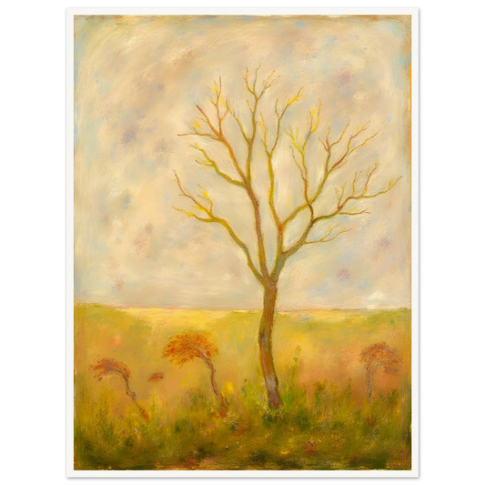 A lone tree stands tall in a golden meadow under a pale sky, its bare branches reaching gracefully toward the light.