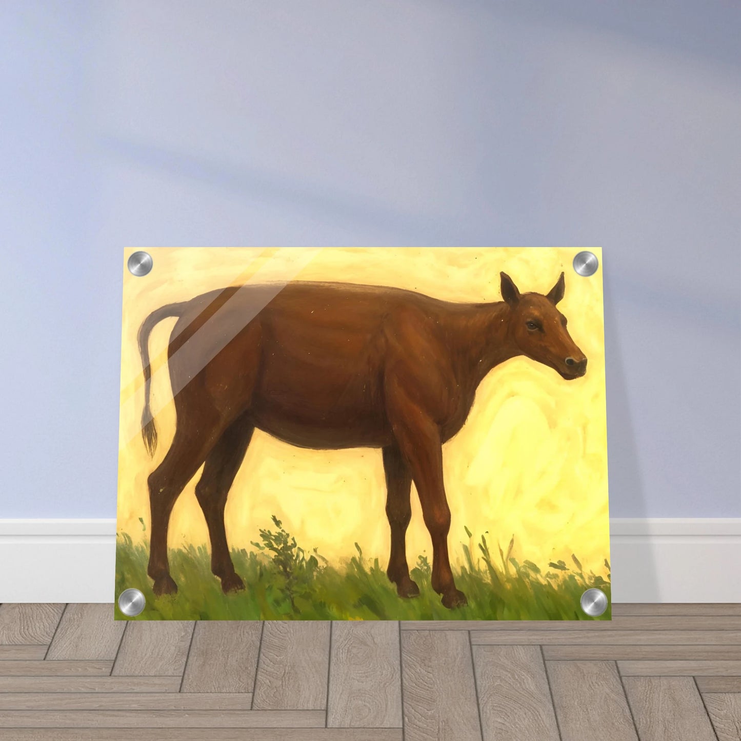 A brown cow standing on grassy pasture against a soft golden-yellow background, exuding calm and simplicity.