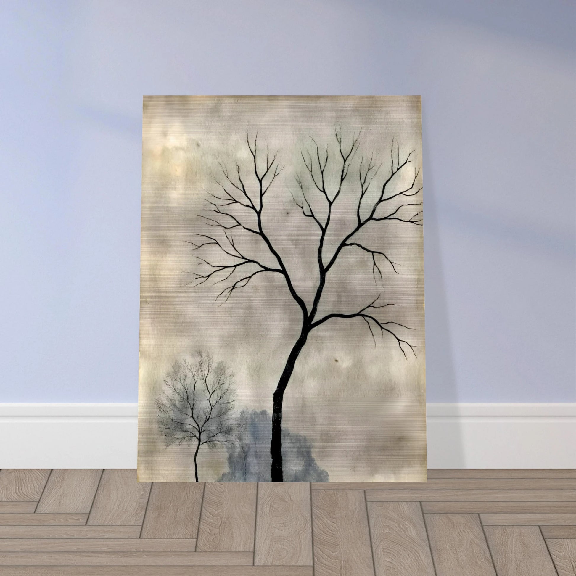 Two leafless trees stand silhouetted against a misty gray sky, evoking a quiet, contemplative atmosphere.