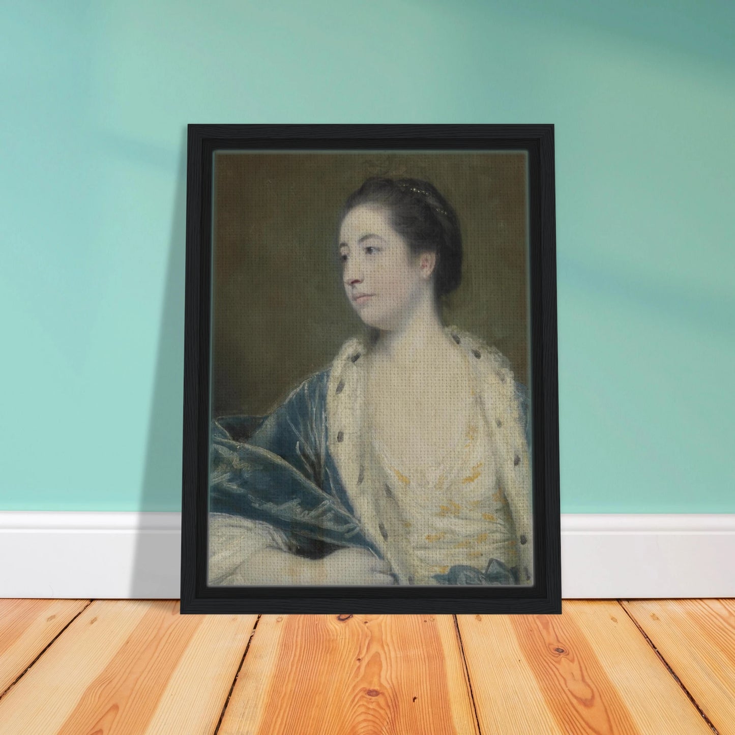Young woman in a blue robe with fur trim poses against a dark green background