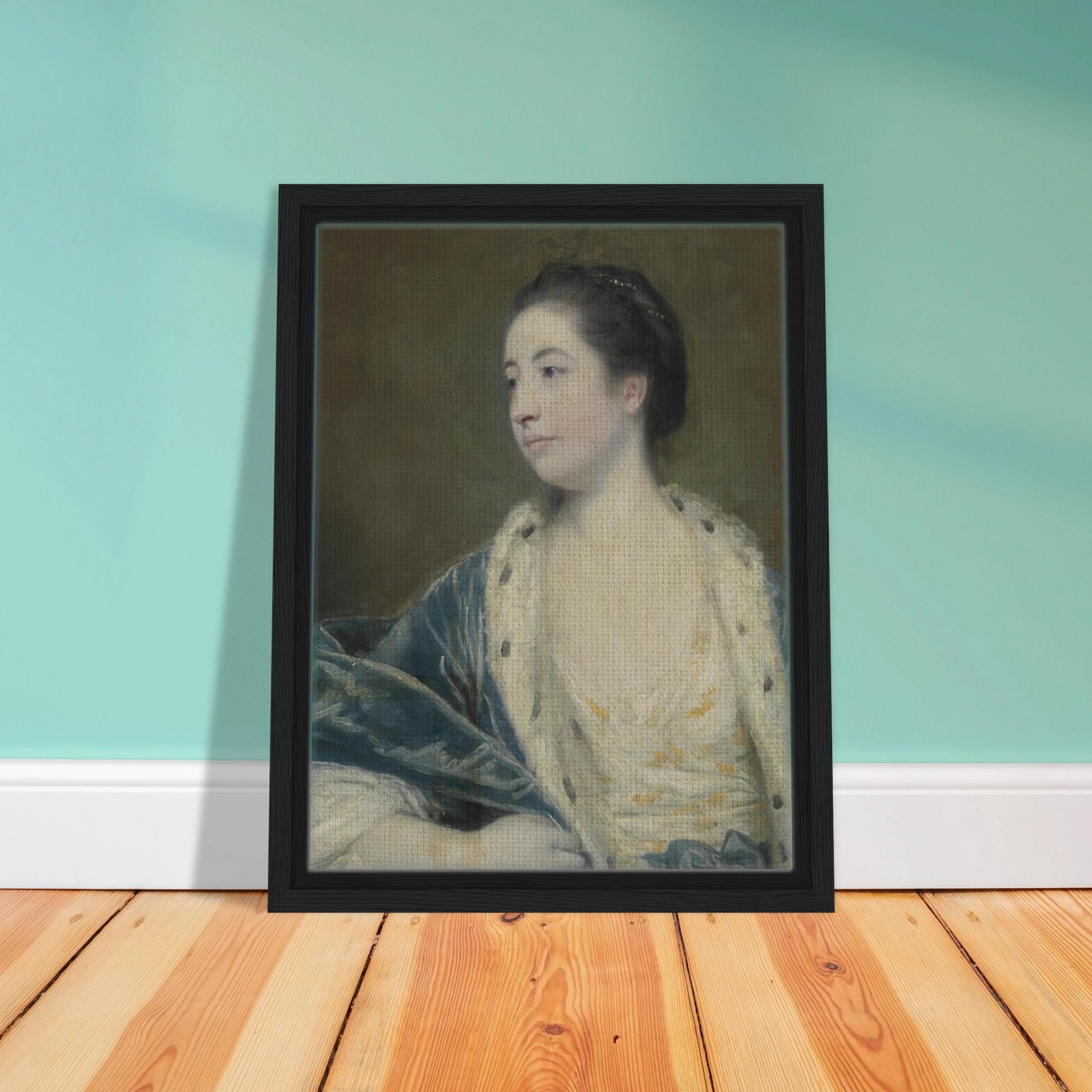 Young woman in a blue robe with fur trim poses against a dark green background