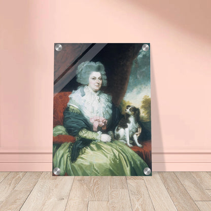 Woman in a green dress sits beside a small black and white dog in a formal portrait