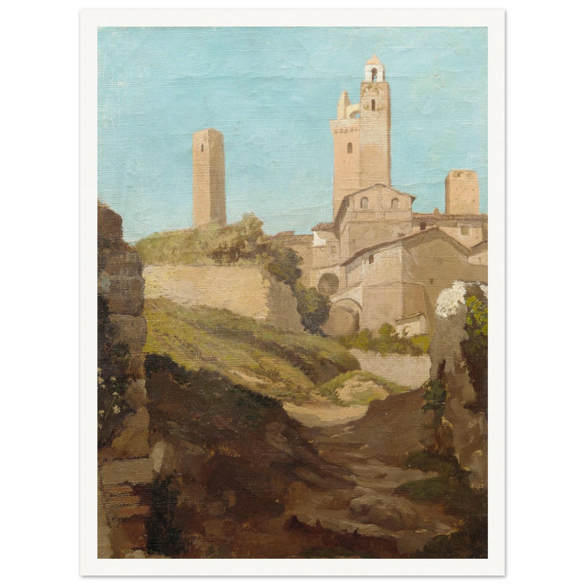 Medieval towers rise above San Gimignano’s sunlit hill town and rough path under a pale blue sky.