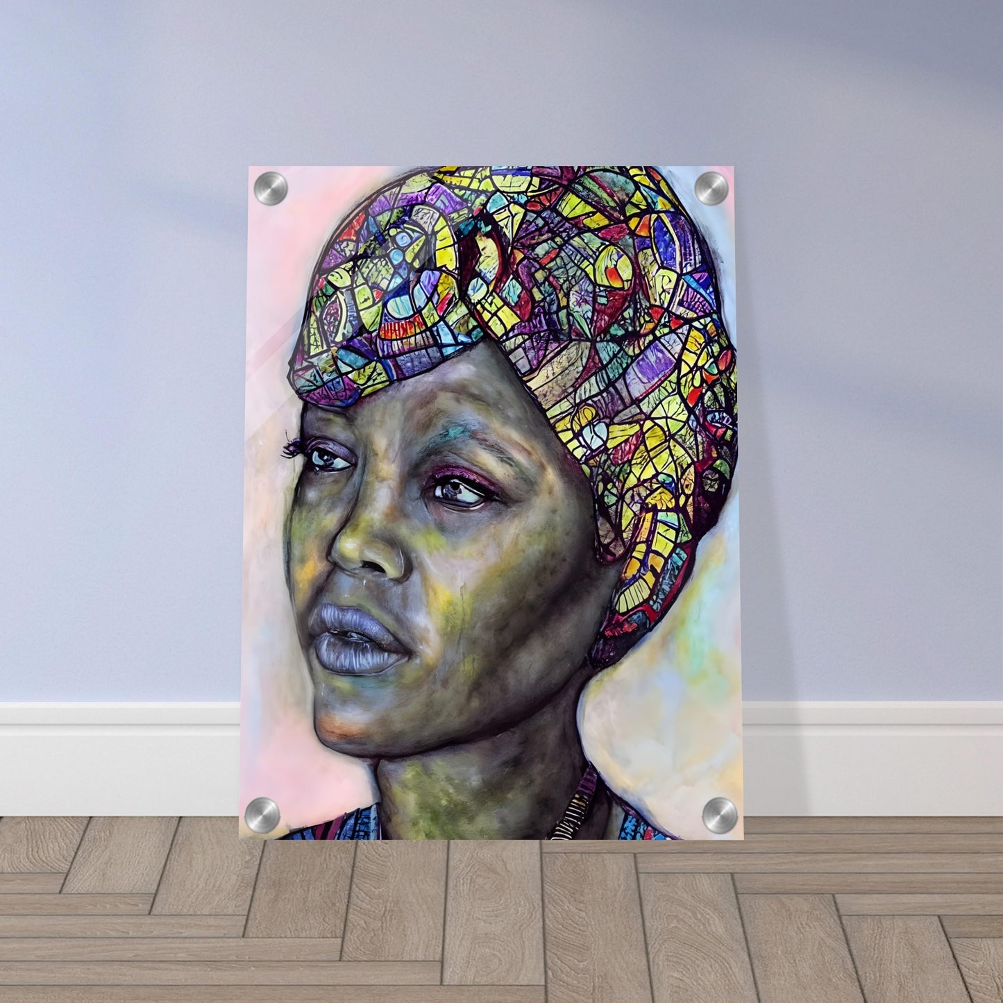 A striking portrait of a woman with a vibrant, mosaic-patterned headwrap, deep expressive eyes, and a contemplative gaze against a soft-toned background.