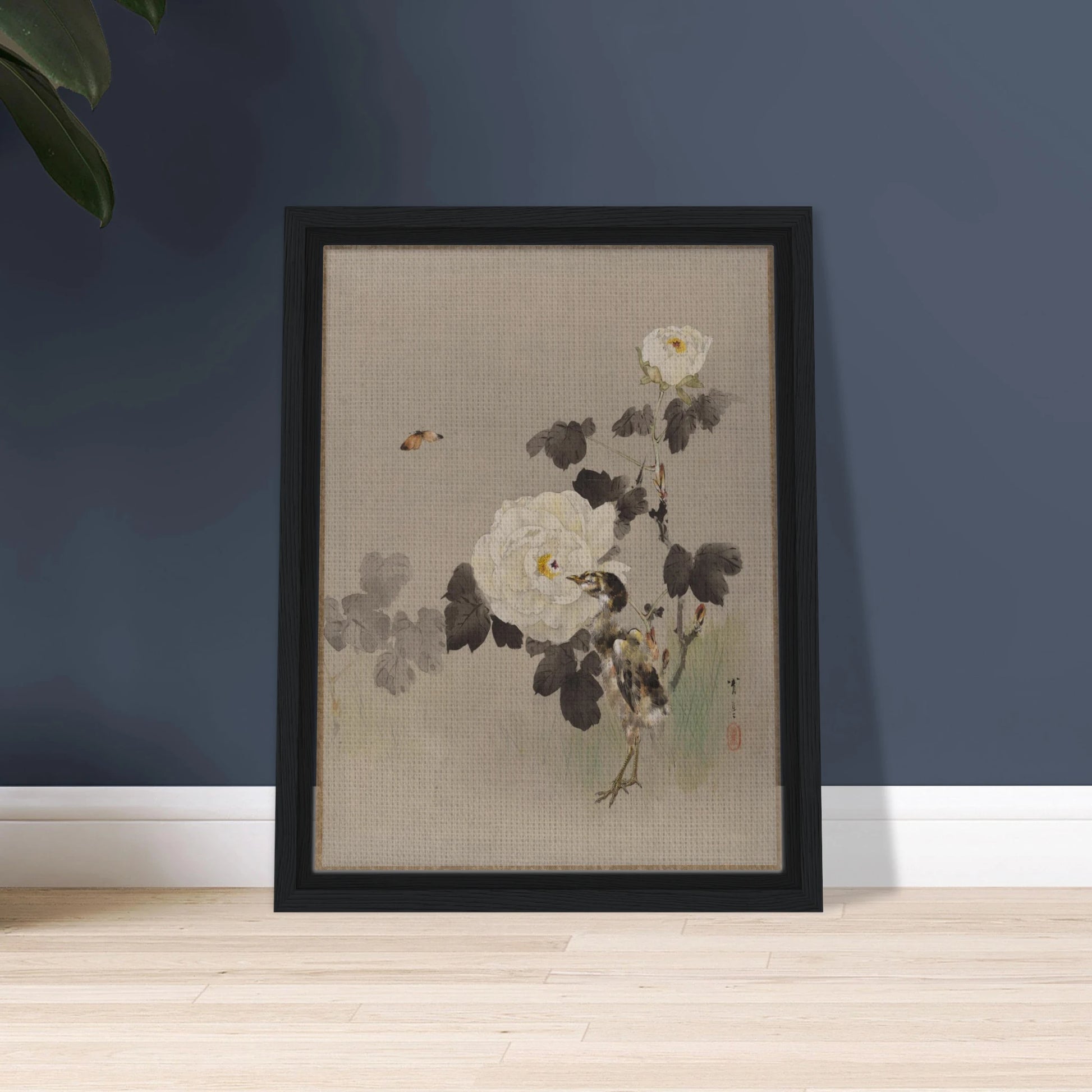 Young bird stands beside white roses as a butterfly flies across a pale silk background