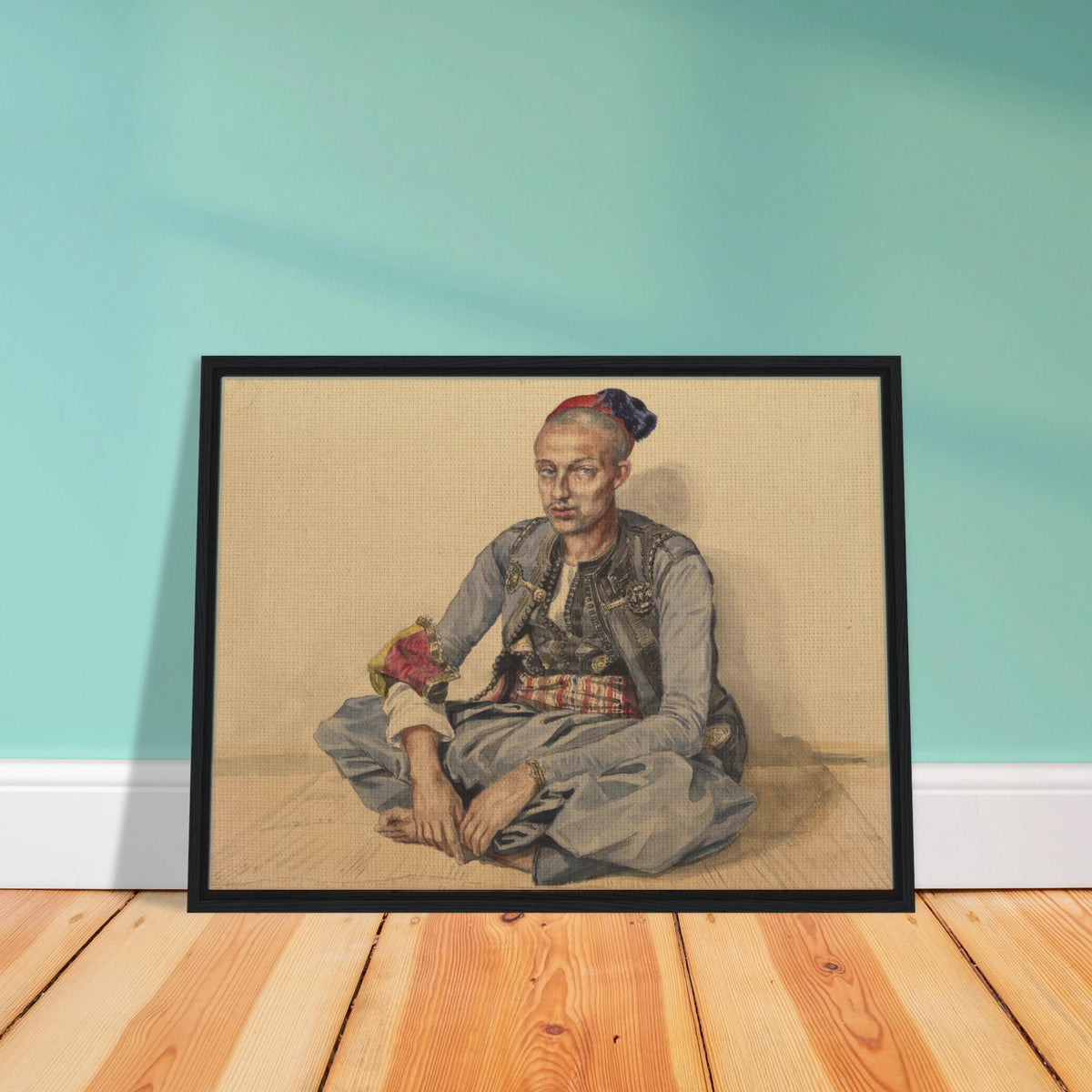 Seated artisan from Algiers in blue robes and a red cap, wearing a patterned sash and ornate accessories.