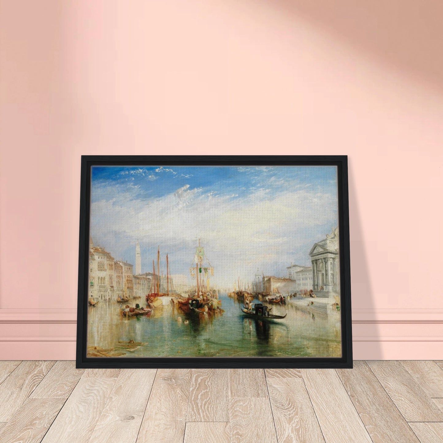 Gondolas and sailing boats fill Venice’s Grand Canal beneath a bright blue sky and luminous clouds.