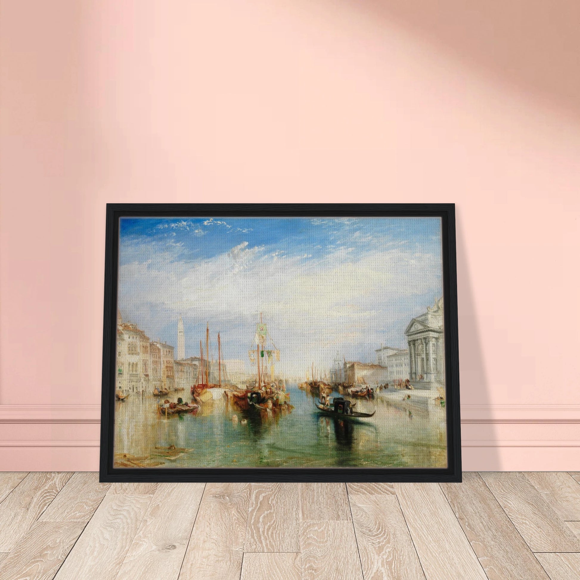 Gondolas and sailing boats fill Venice’s Grand Canal beneath a bright blue sky and luminous clouds.