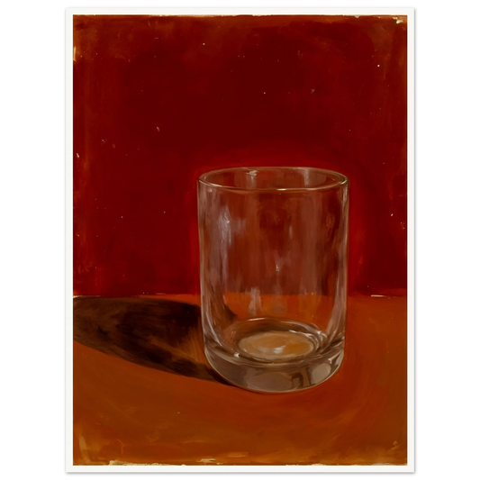 Transparent drinking glass casting a soft shadow on a warm orange and red background.
