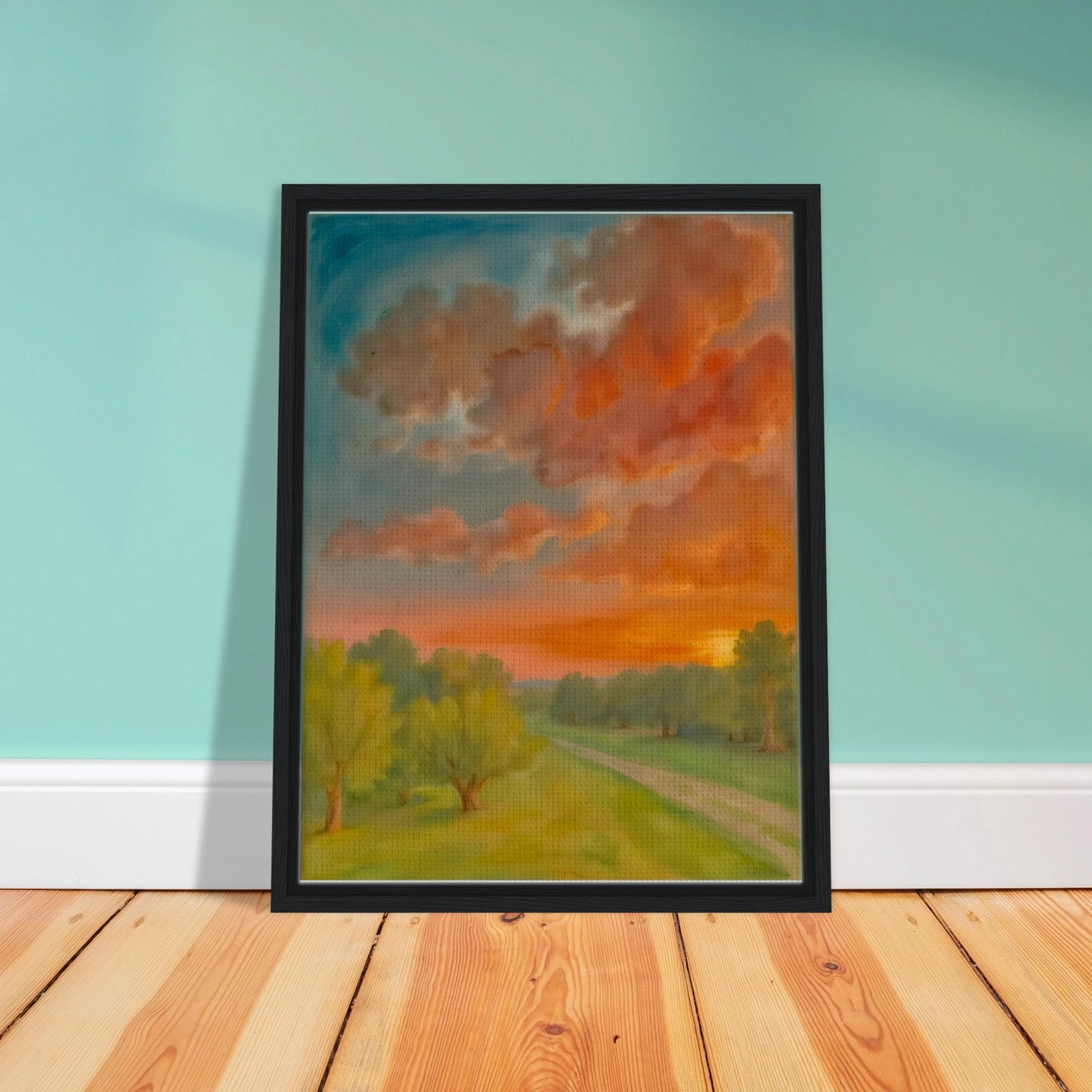Soft orange clouds drift above a winding country path, with green trees and fading sunlight across open fields.