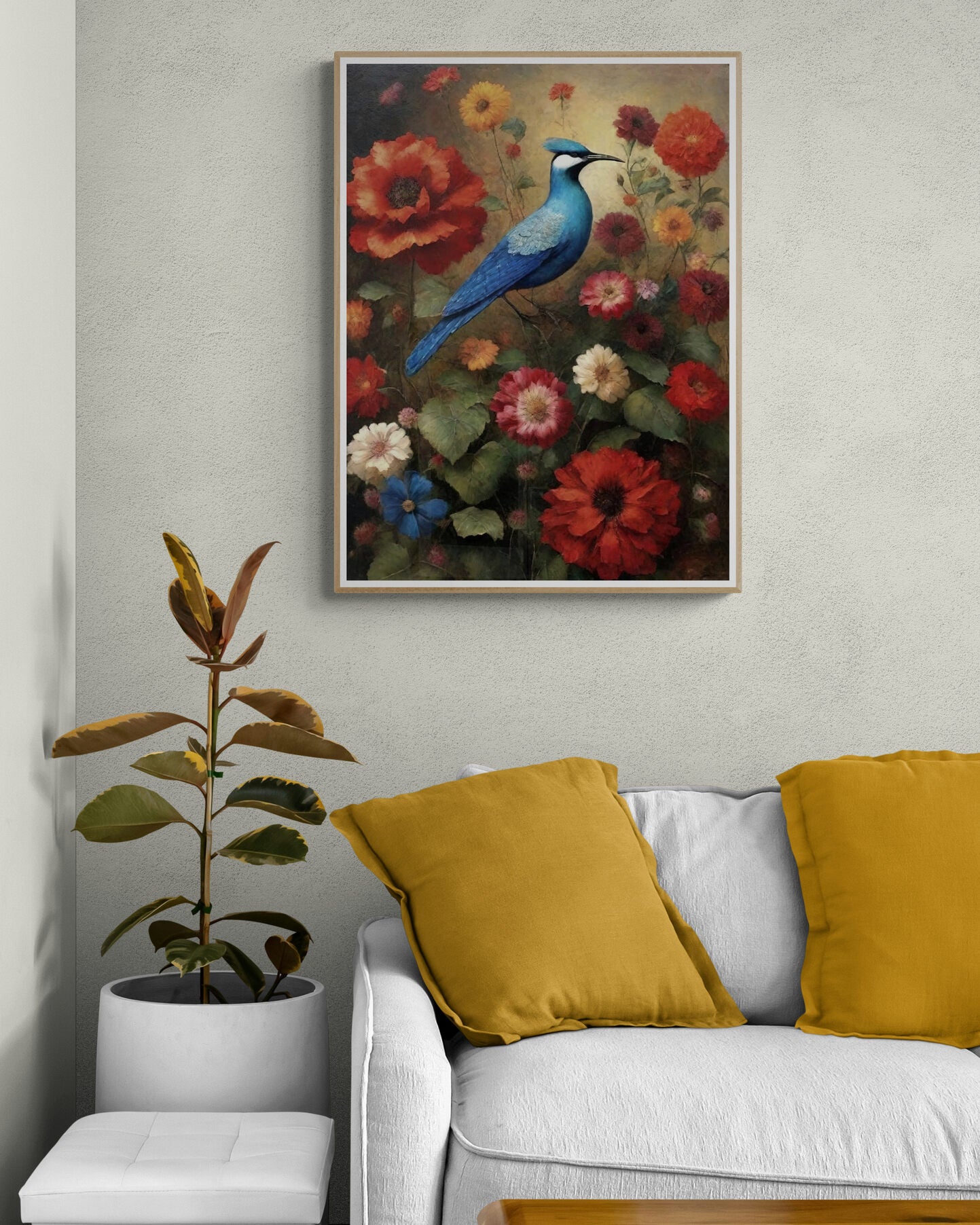 Living room featuring a framed bird wall art of a blue bird perched among vibrant flowers, paired with a white sofa and mustard yellow pillows.