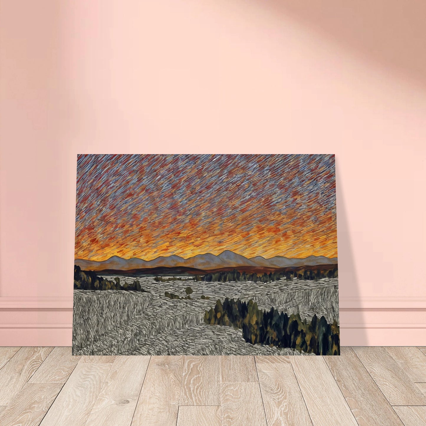 Vibrant orange sunset over distant mountains with textured sky and patterned fields in the foreground.