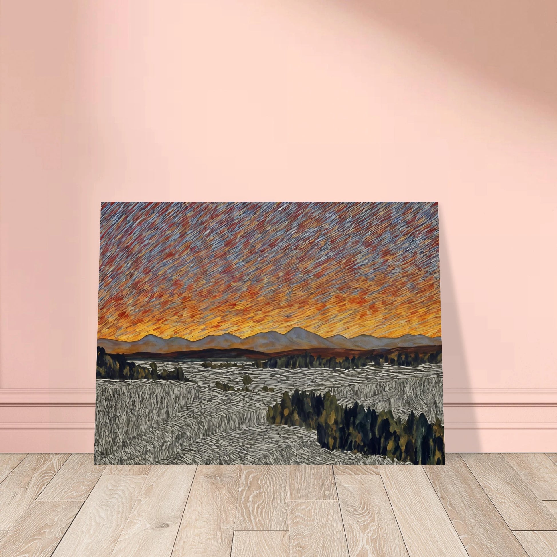 Vibrant orange sunset over distant mountains with textured sky and patterned fields in the foreground.