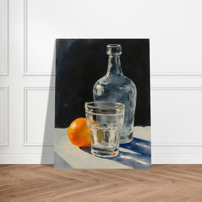 A clear glass, bottle, and orange sit on a sunlit surface, casting soft shadows against a dark background.