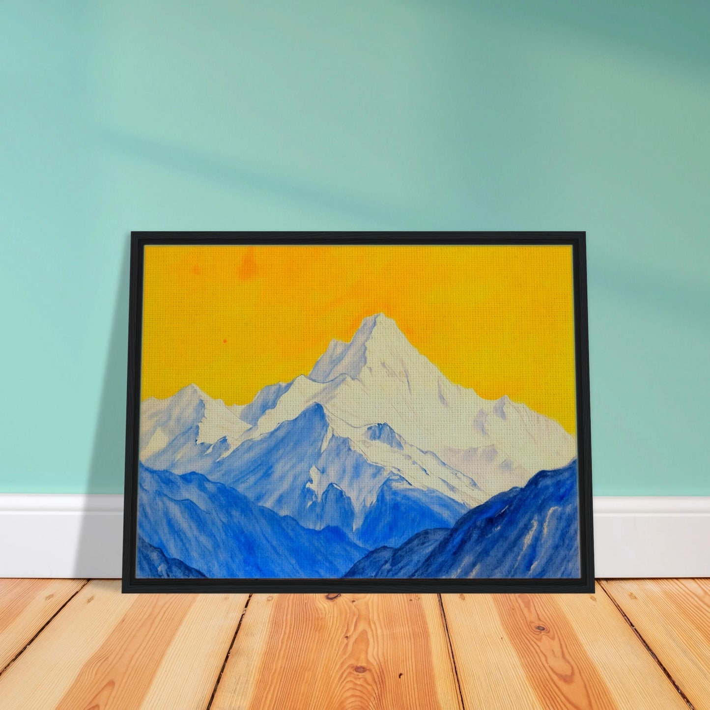 Snowy blue mountain ranges rise beneath a brilliant golden sky, blending icy grandeur with vivid warmth.