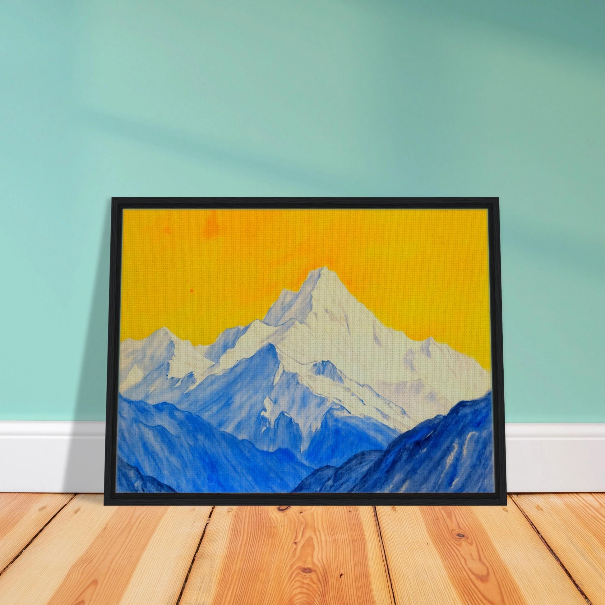 Snowy blue mountain ranges rise beneath a brilliant golden sky, blending icy grandeur with vivid warmth.