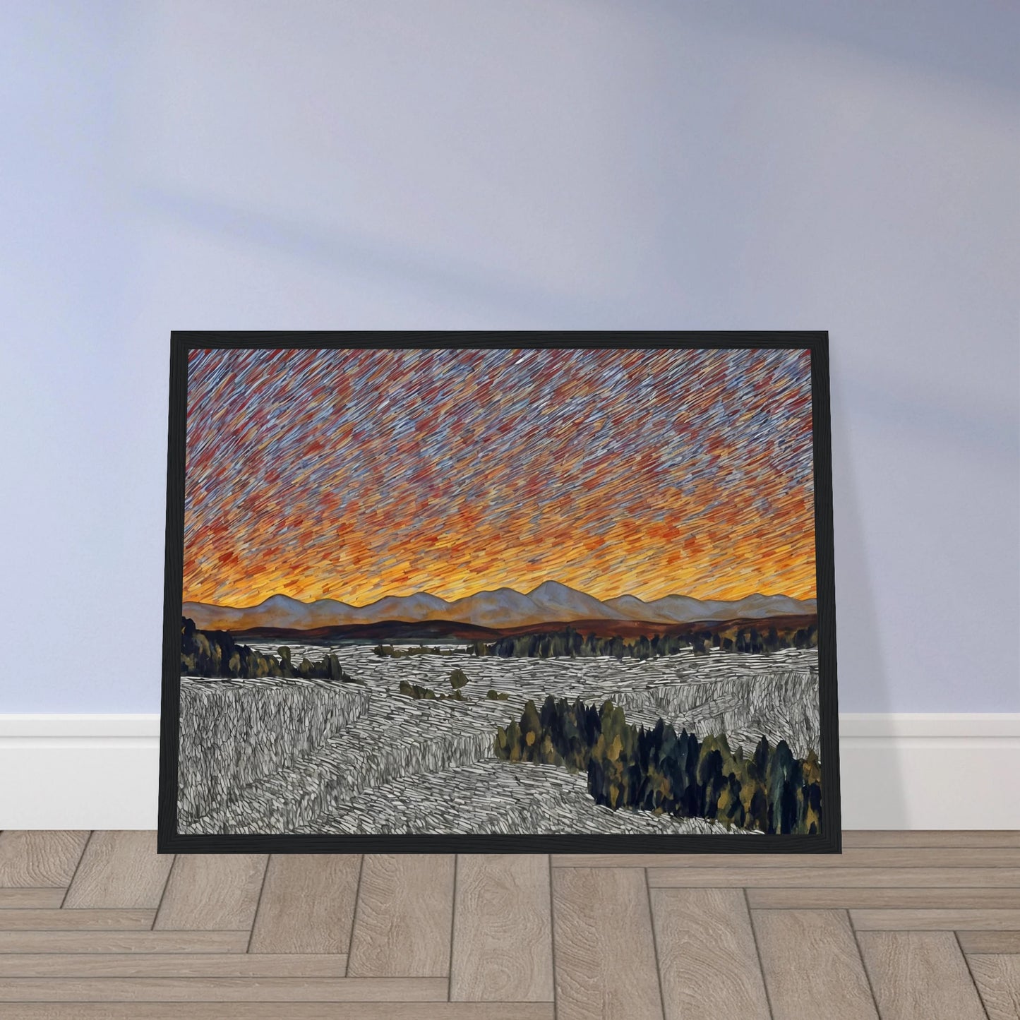 Vibrant orange sunset over distant mountains with textured sky and patterned fields in the foreground.
