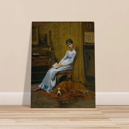 Woman in a blue dress sits with papers beside a sleeping setter dog in a dim studio interior.