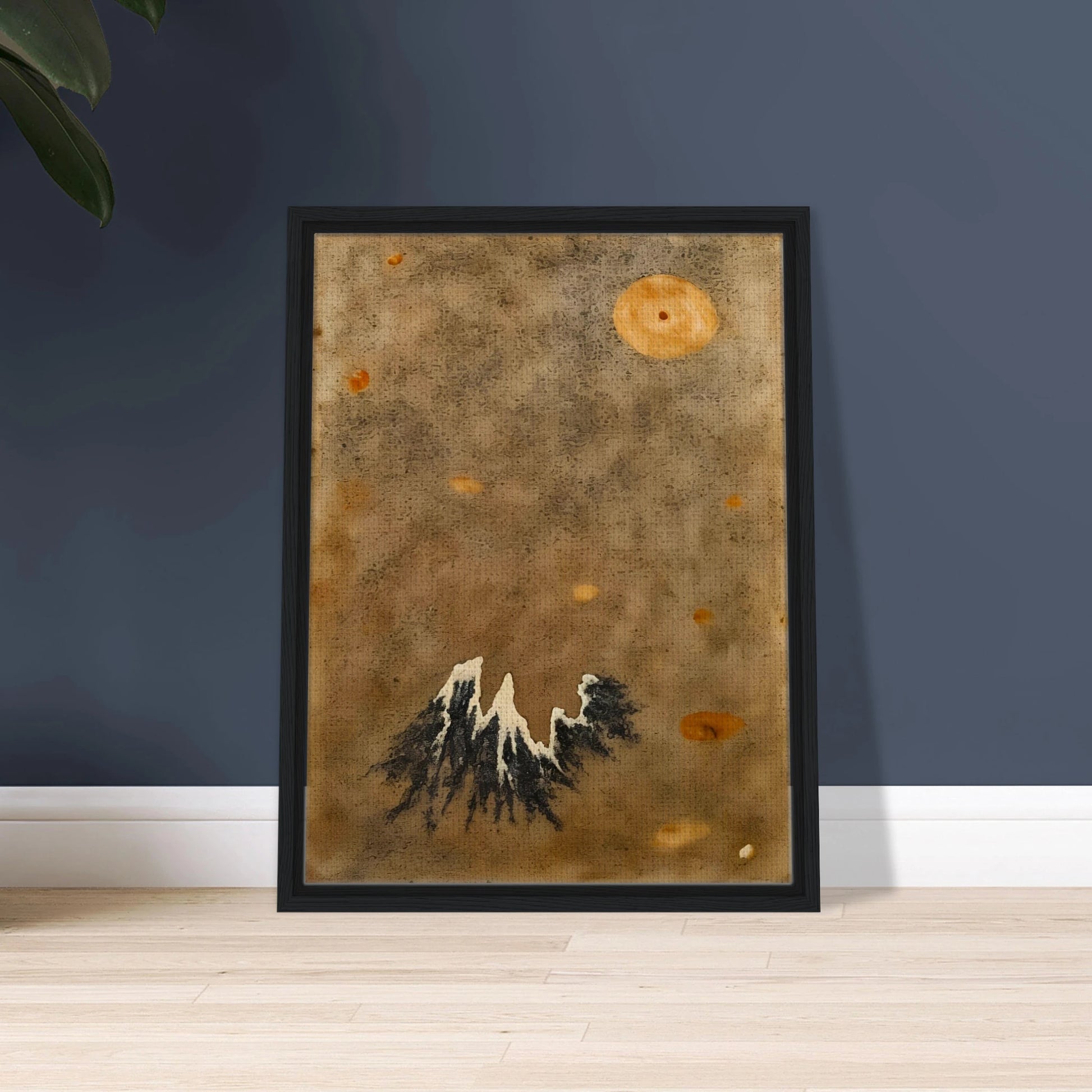 Snow-capped black mountain rises below a hazy orange moon in a muted, dust-toned sky.