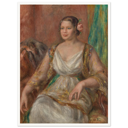 A seated woman in a soft white dress with a pink rose in her hair rests against a warm interior.