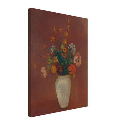 Flowers in a white vase against a red background with yellow and orange blooms