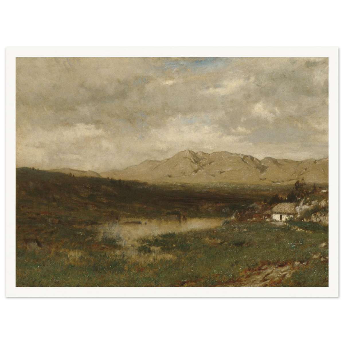 A rural cottage sits below distant mountains beneath a broad, cloudy sky in the Irish countryside.