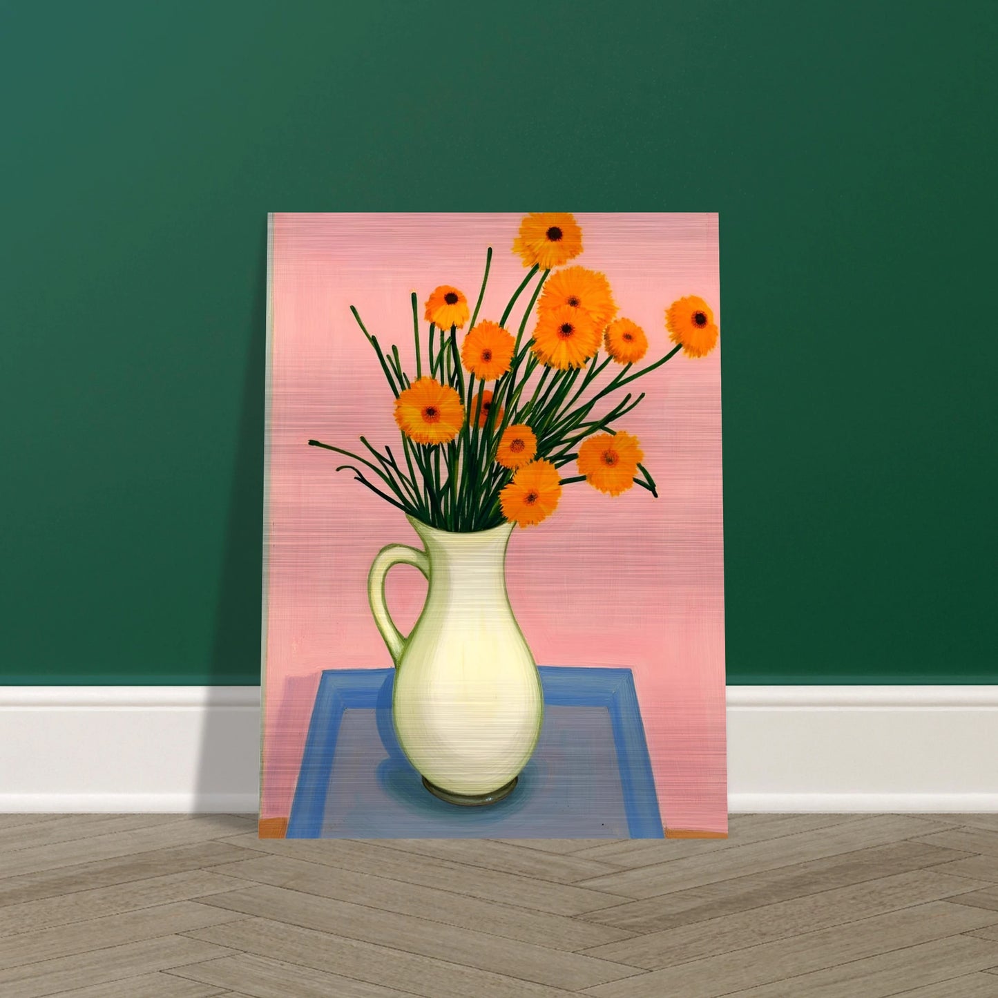 A vase of orange daisies with green stems against a soft pink background, radiating warmth and joy on a pastel tabletop.