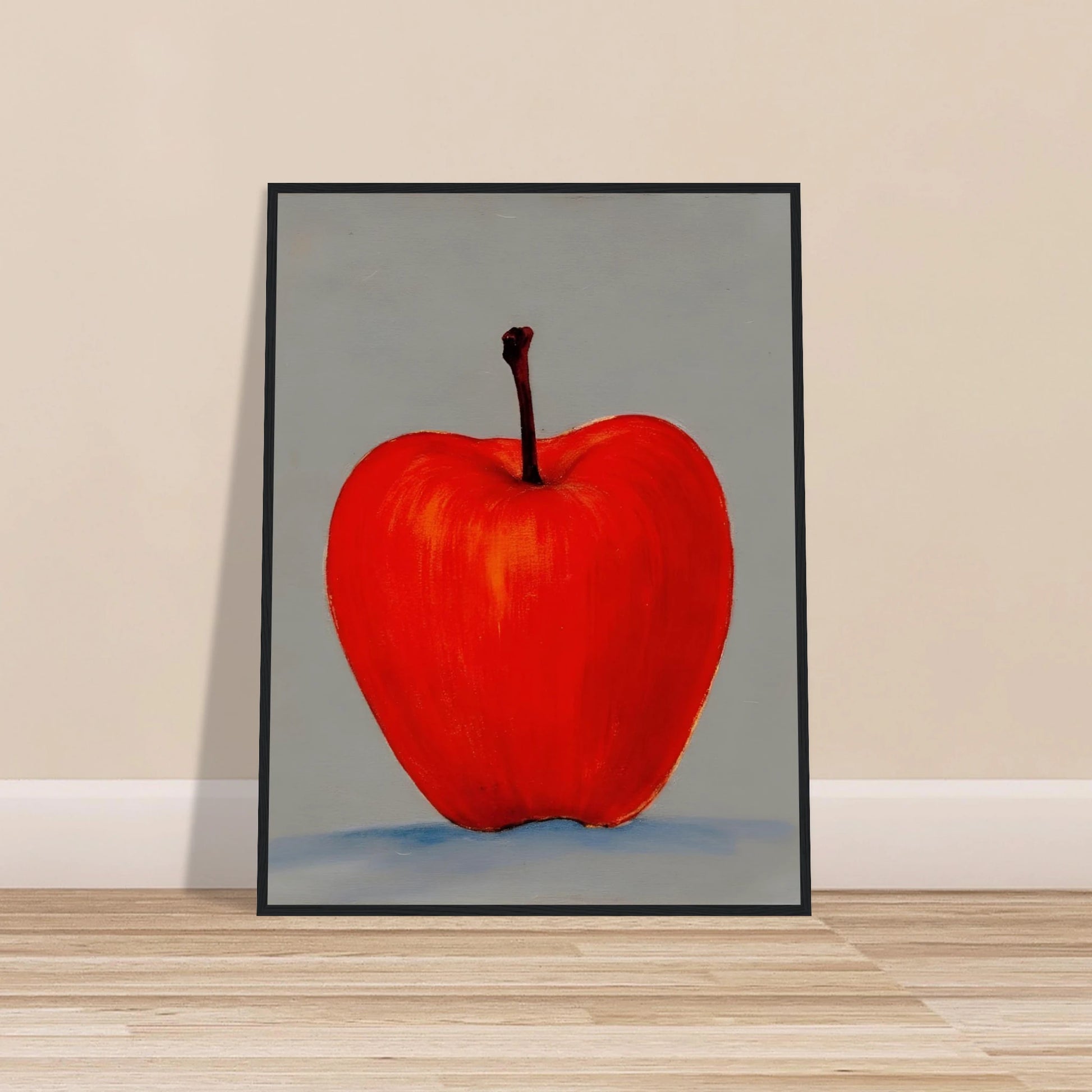 A vivid red apple stands alone against a muted gray backdrop, its glowing form balancing simplicity, boldness, and quiet elegance.