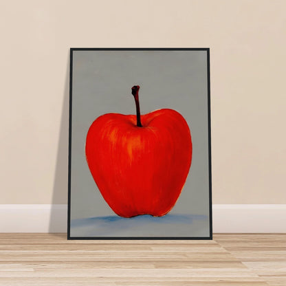A vivid red apple stands alone against a muted gray backdrop, its glowing form balancing simplicity, boldness, and quiet elegance.