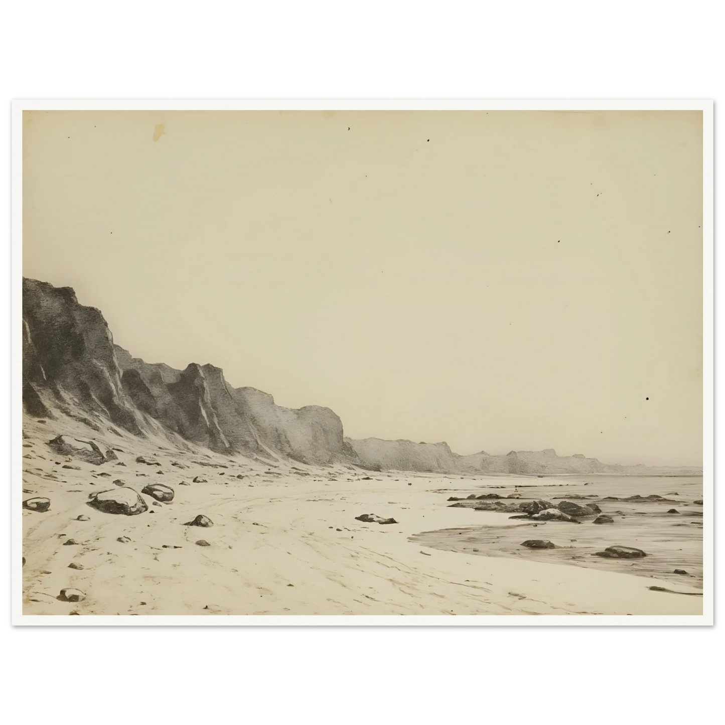 Minimal coastal landscape with pale sandy shore, rugged cliffs, scattered stones, and calm sea rendered in soft monochrome tones.