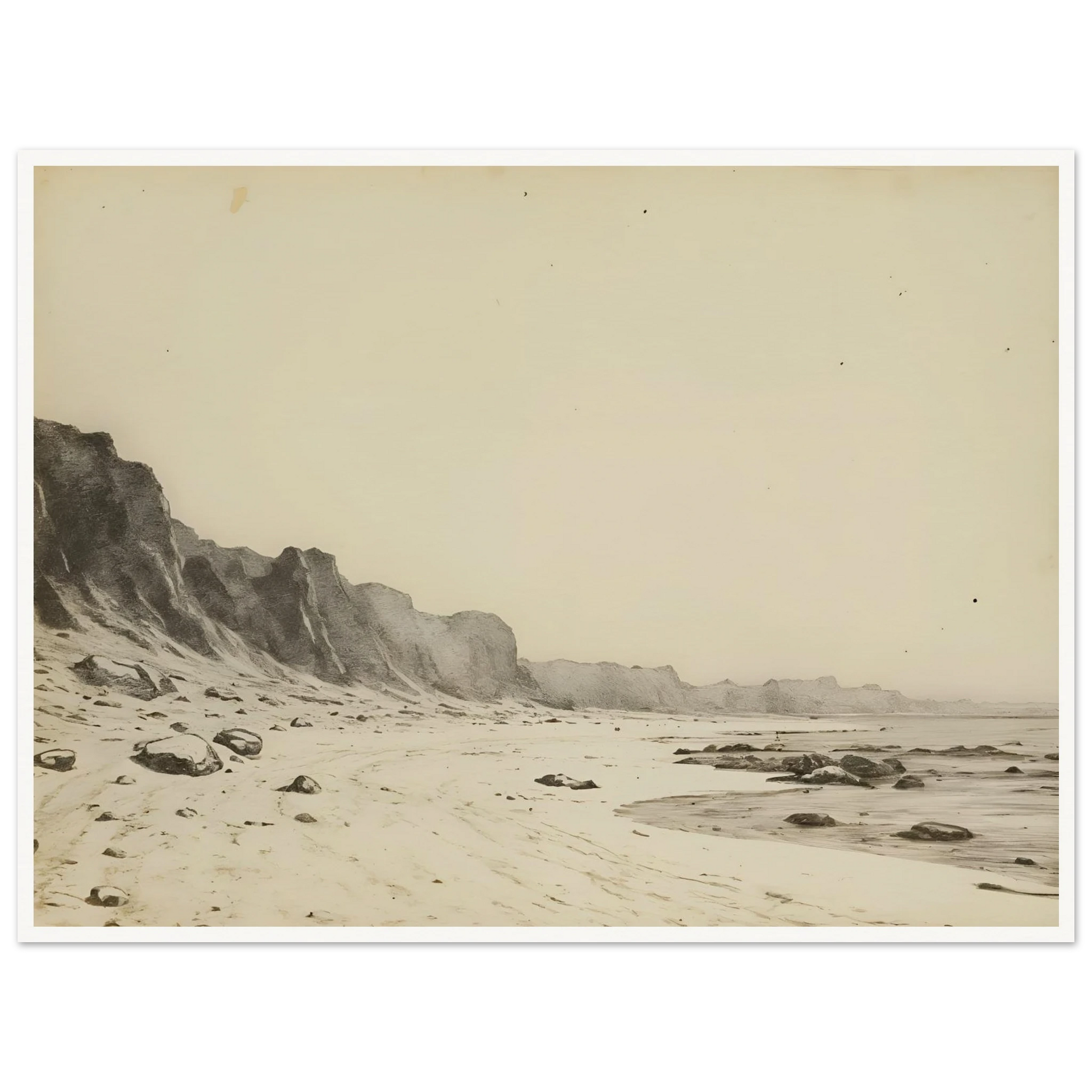Minimal coastal landscape with pale sandy shore, rugged cliffs, scattered stones, and calm sea rendered in soft monochrome tones.