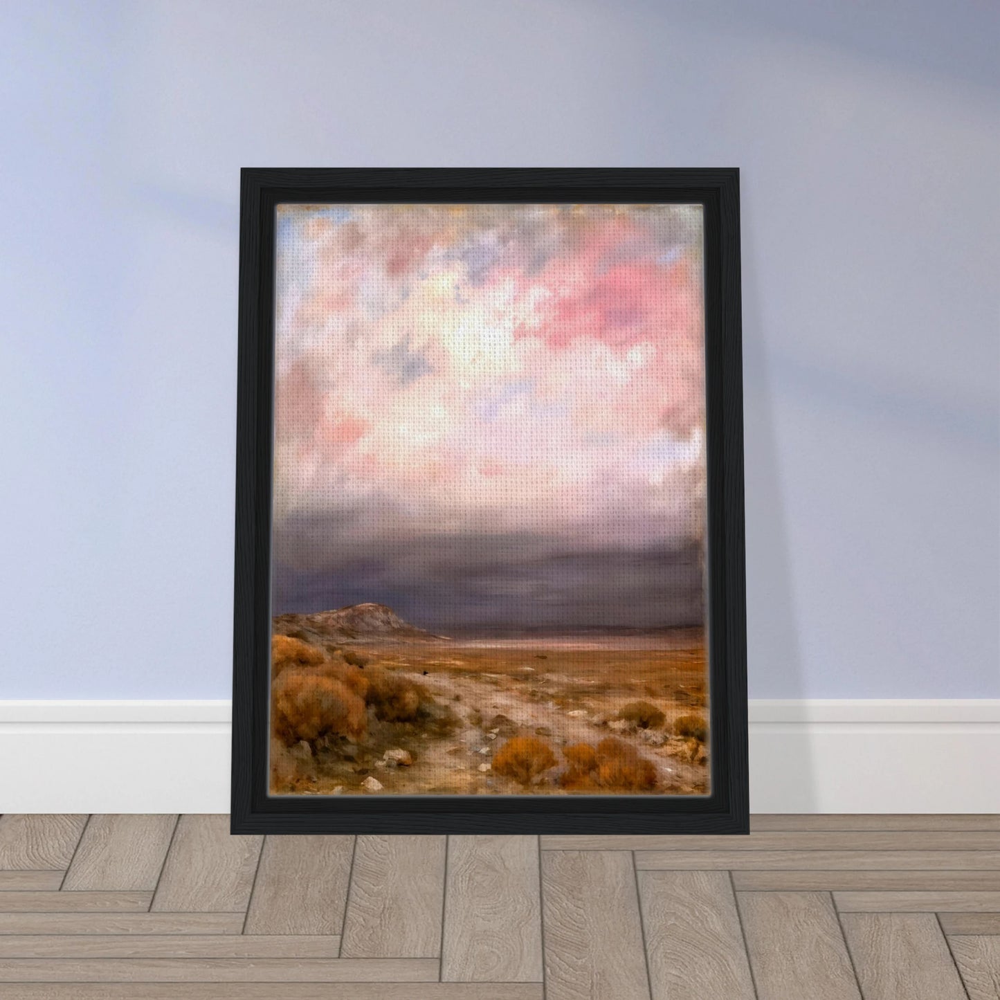 A dreamy desert landscape beneath soft pink and lavender clouds, with golden brush, distant hills, and a tranquil open horizon.