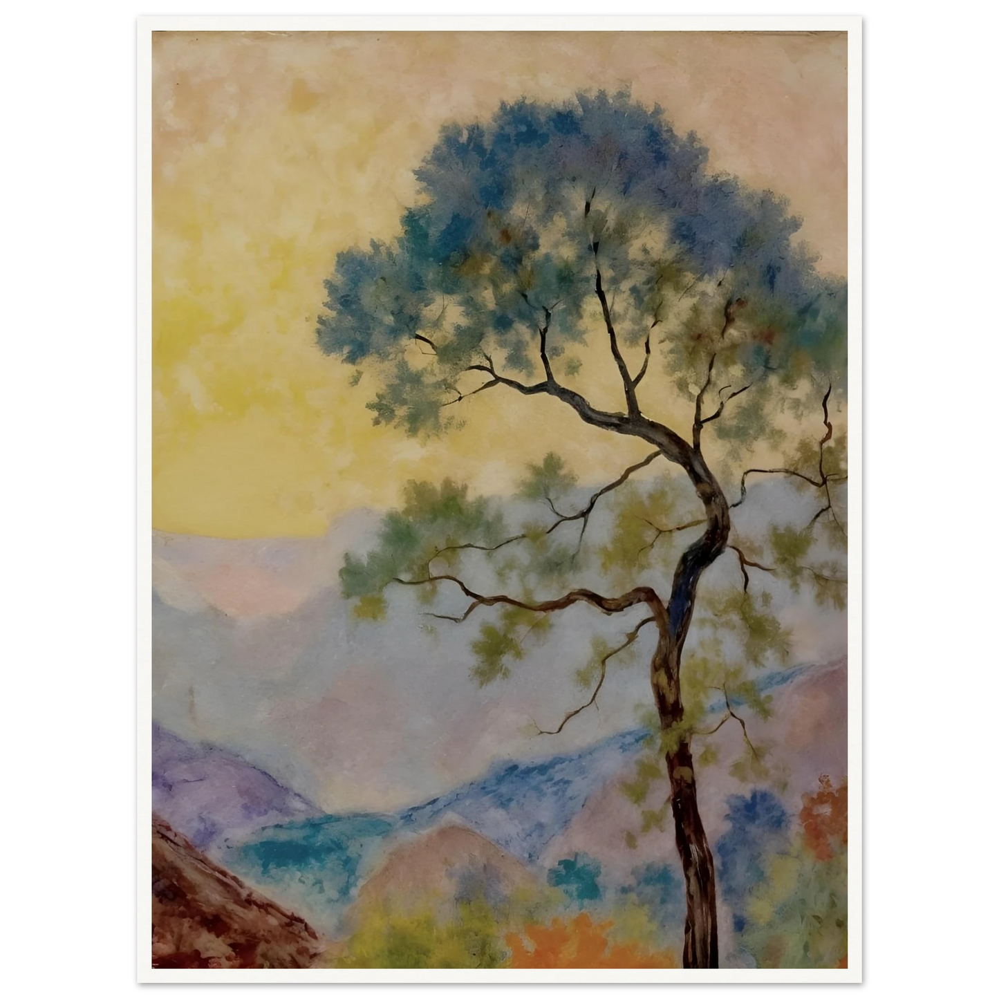 Delicate tree with green-blue foliage standing before pastel mountains under a soft yellow dawn sky.