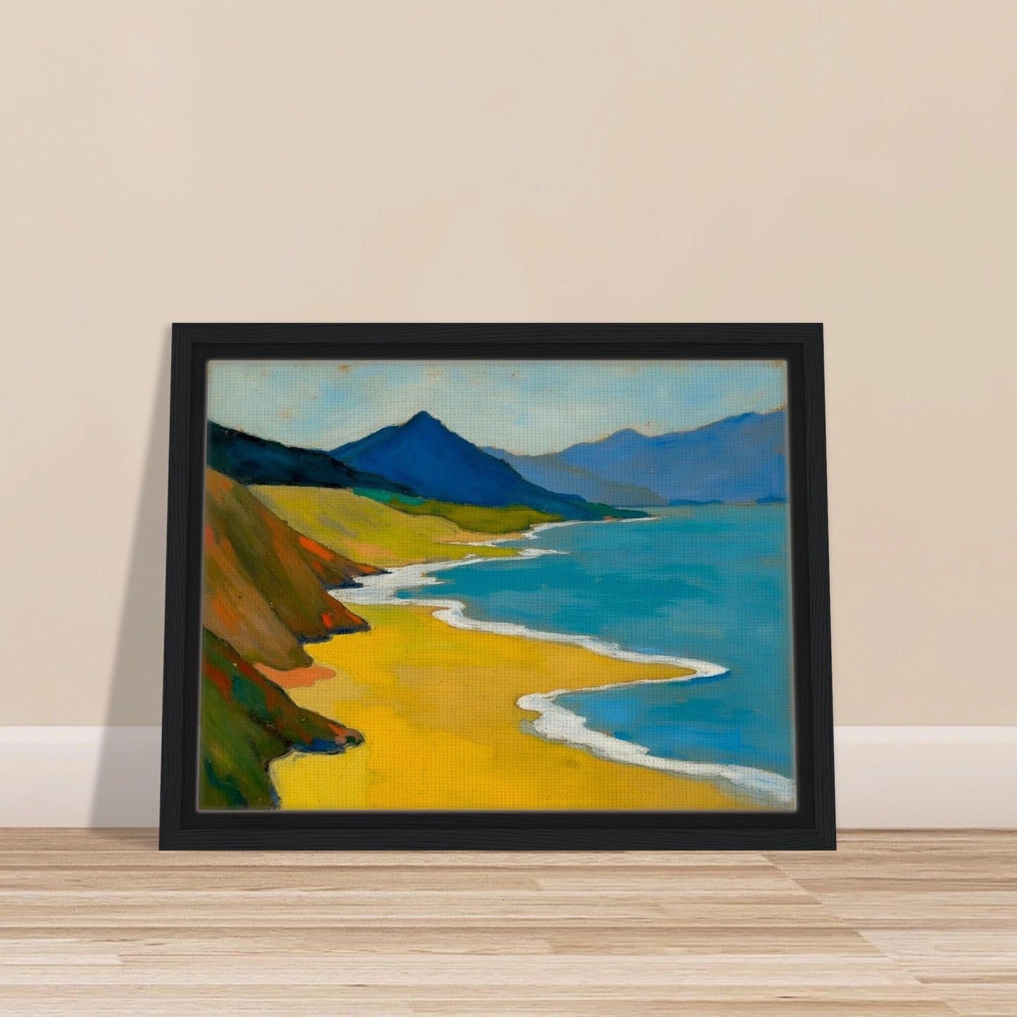 Golden shoreline curves beside turquoise water, green hills, and blue mountains under a pale sky.