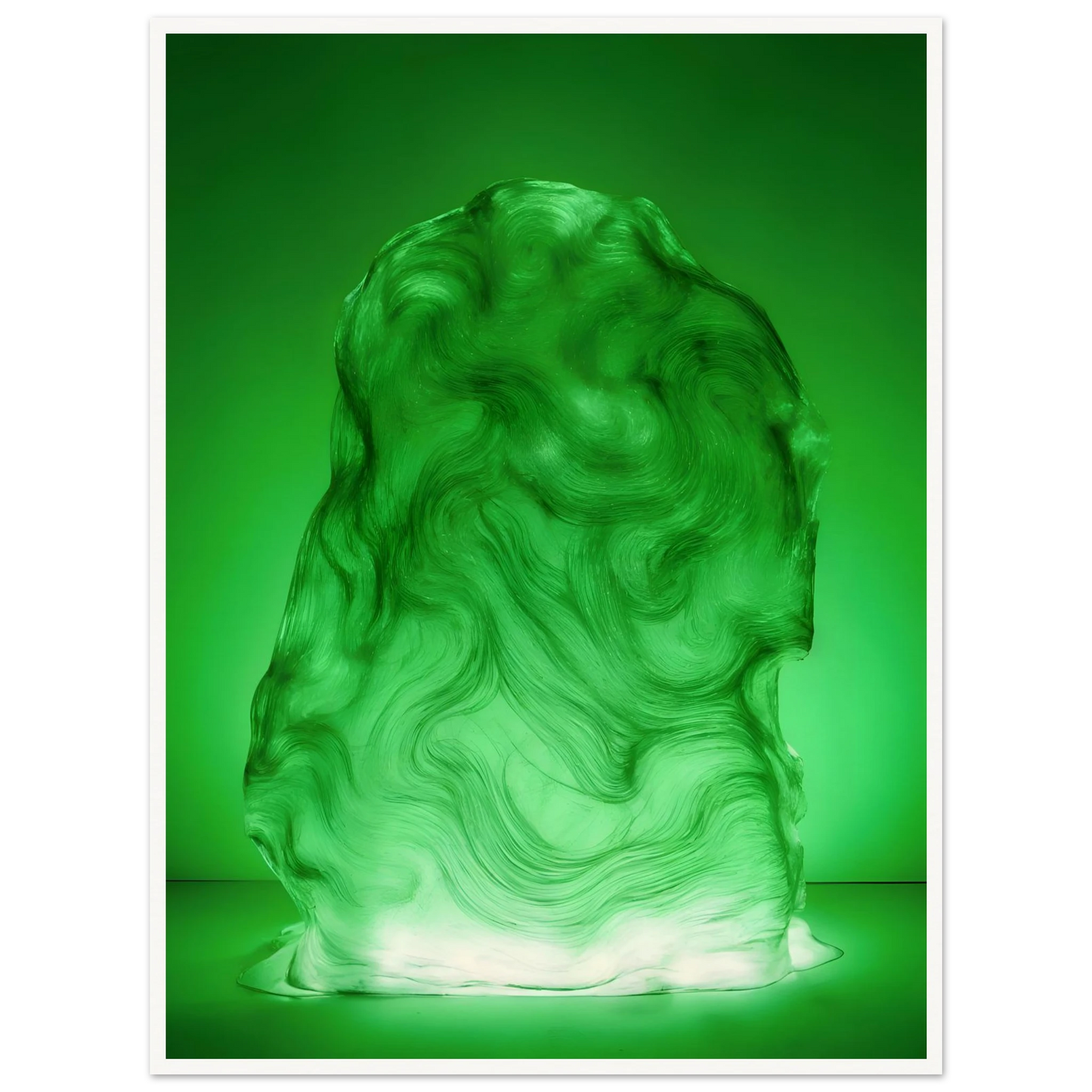 Glowing green sculptural form with fluid marbled swirls rises like illuminated jade, blending movement, mystery, and organic elegance.
