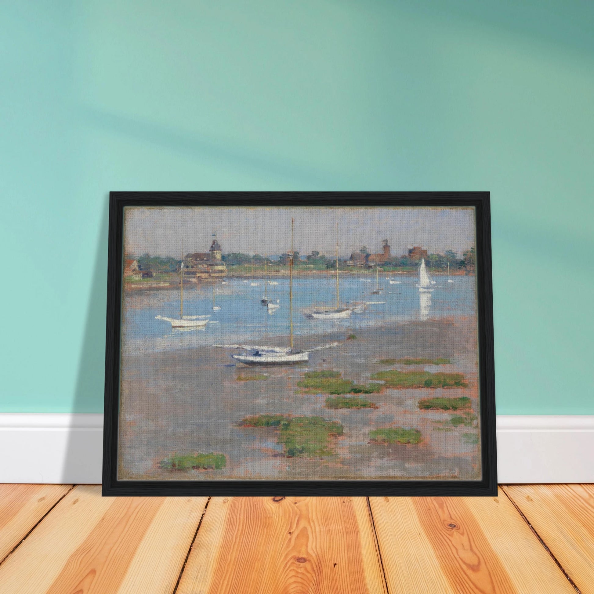 Sailboats rest at low tide near Riverside Yacht Club under hazy blue skies