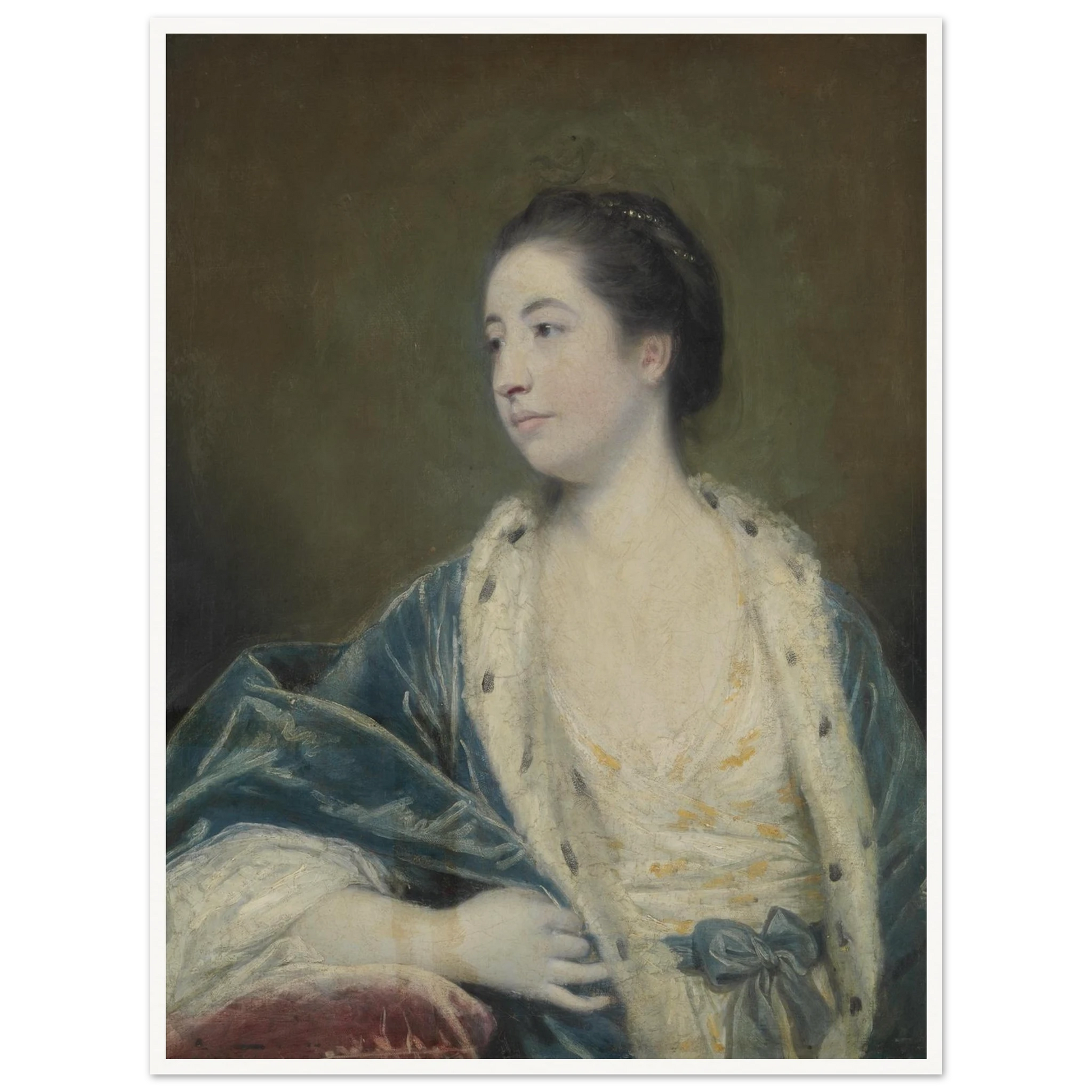 Young woman in a blue robe with fur trim poses against a dark green background