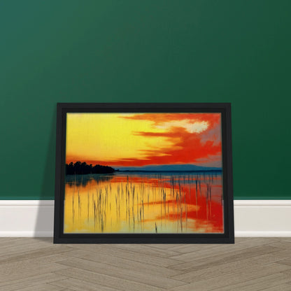 A vivid sunset over calm waters, where orange and yellow hues mirror the sky’s fiery glow and reeds stand in quiet balance.