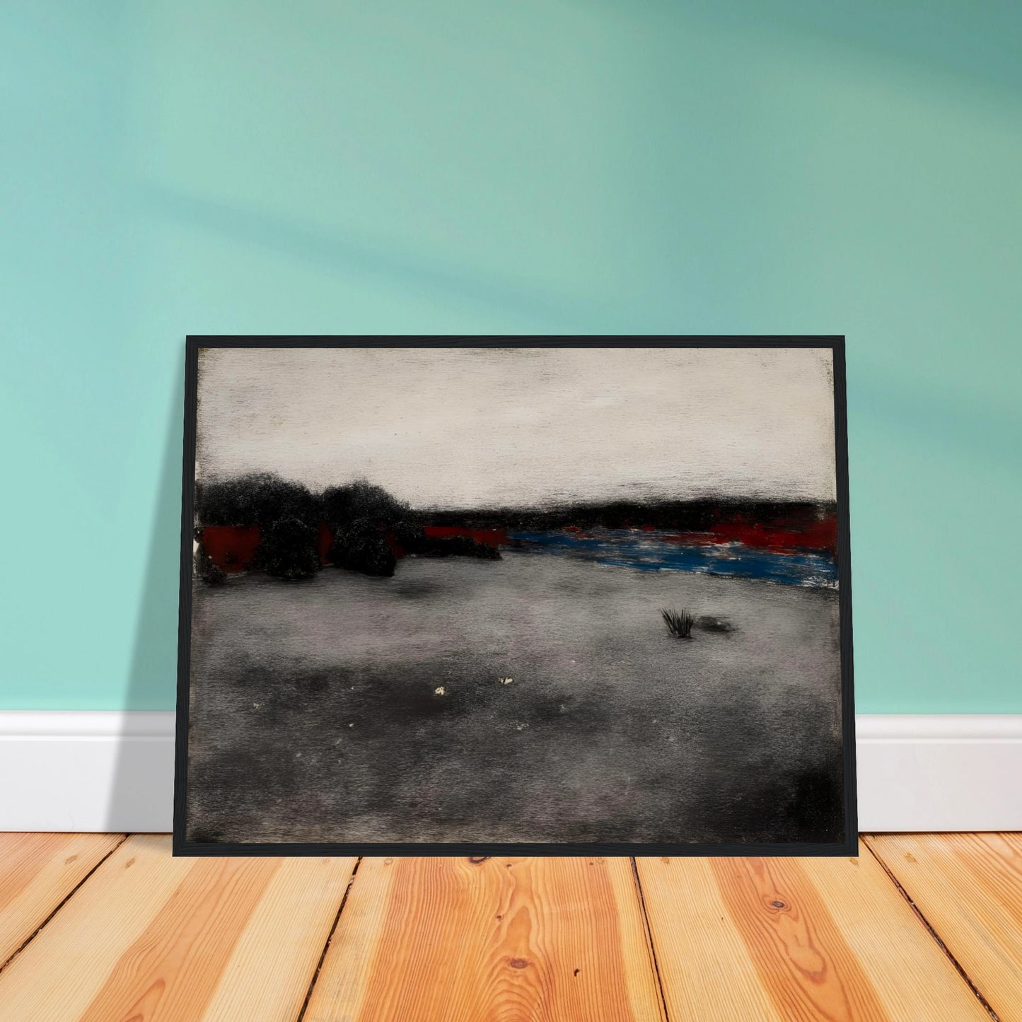 Gray marshland stretches beneath a pale sky, with dark trees and blue water along the horizon.