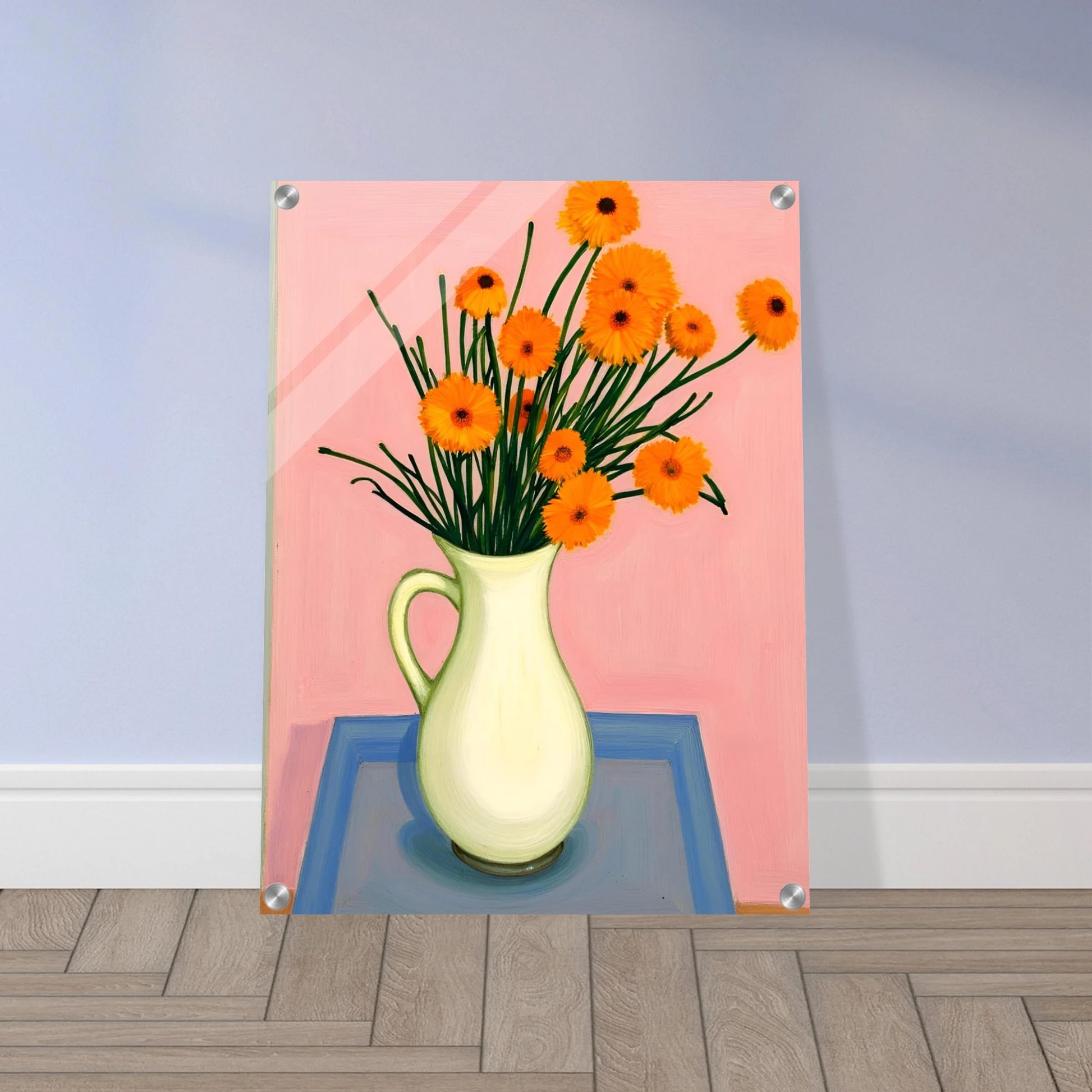 A vase of orange daisies with green stems against a soft pink background, radiating warmth and joy on a pastel tabletop.