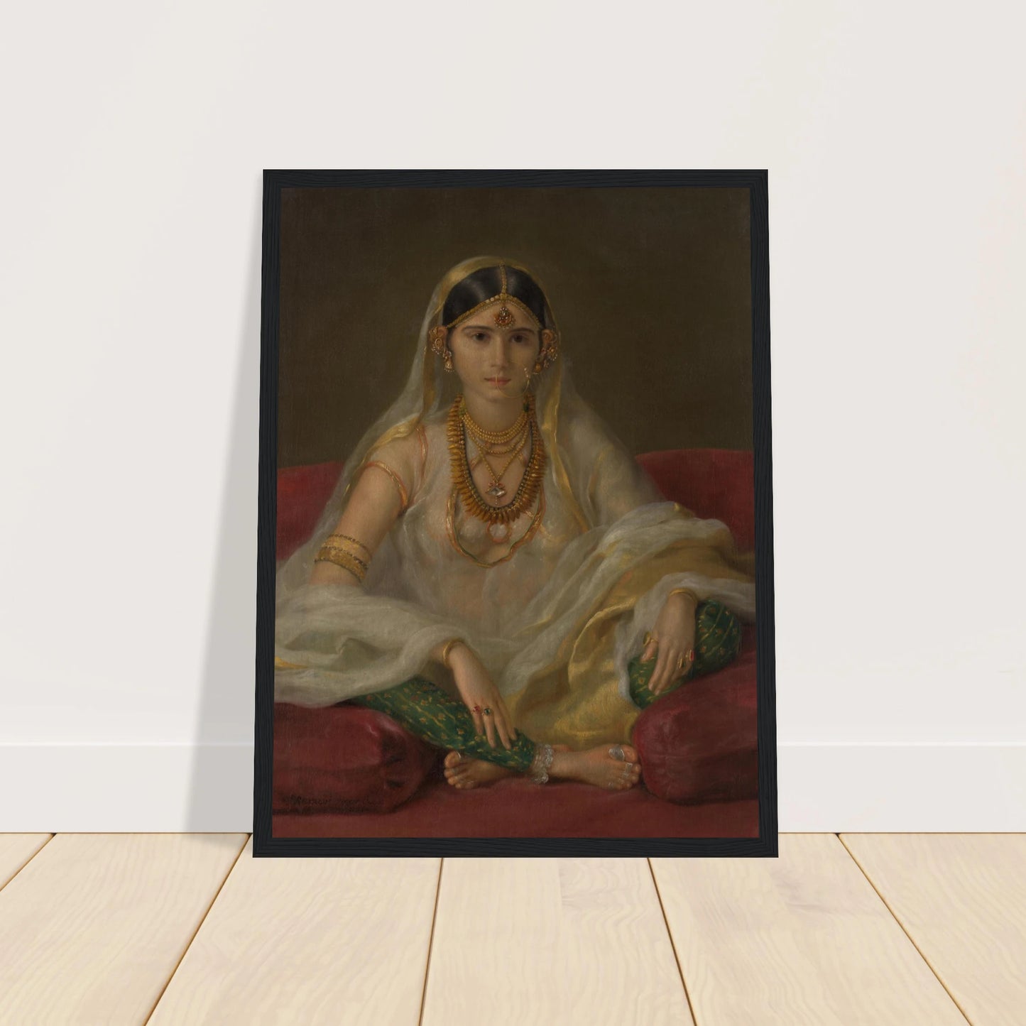 A Mughal woman in a sheer white veil and gold jewelry sits cross-legged on deep red cushions.